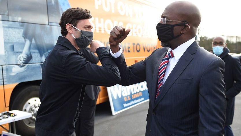 Raphael Warnock y Jon Ossoff en la campaña